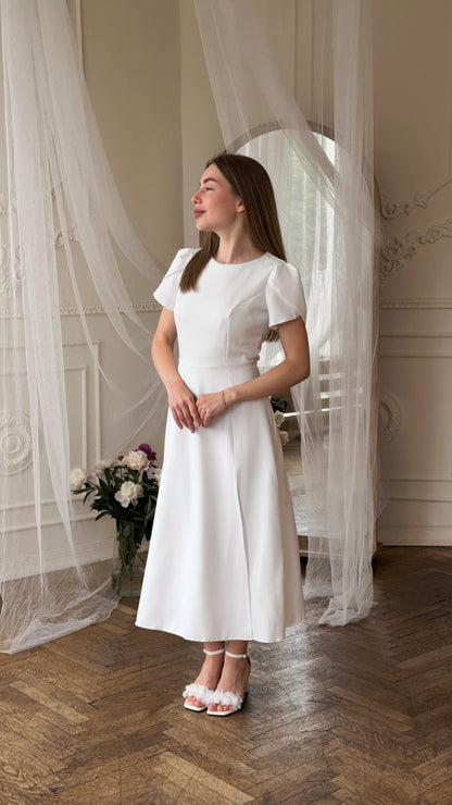 Dress with an open back and a leg slit