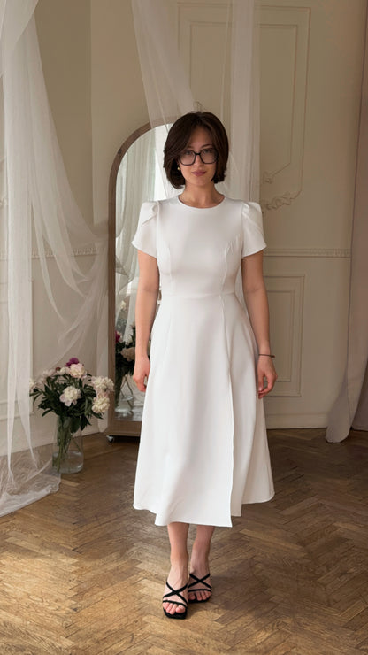 Dress with an open back and a leg slit