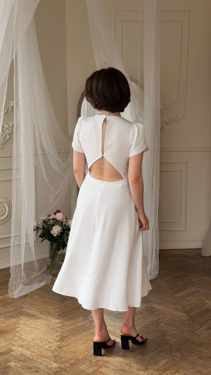 Dress with an open back and a leg slit