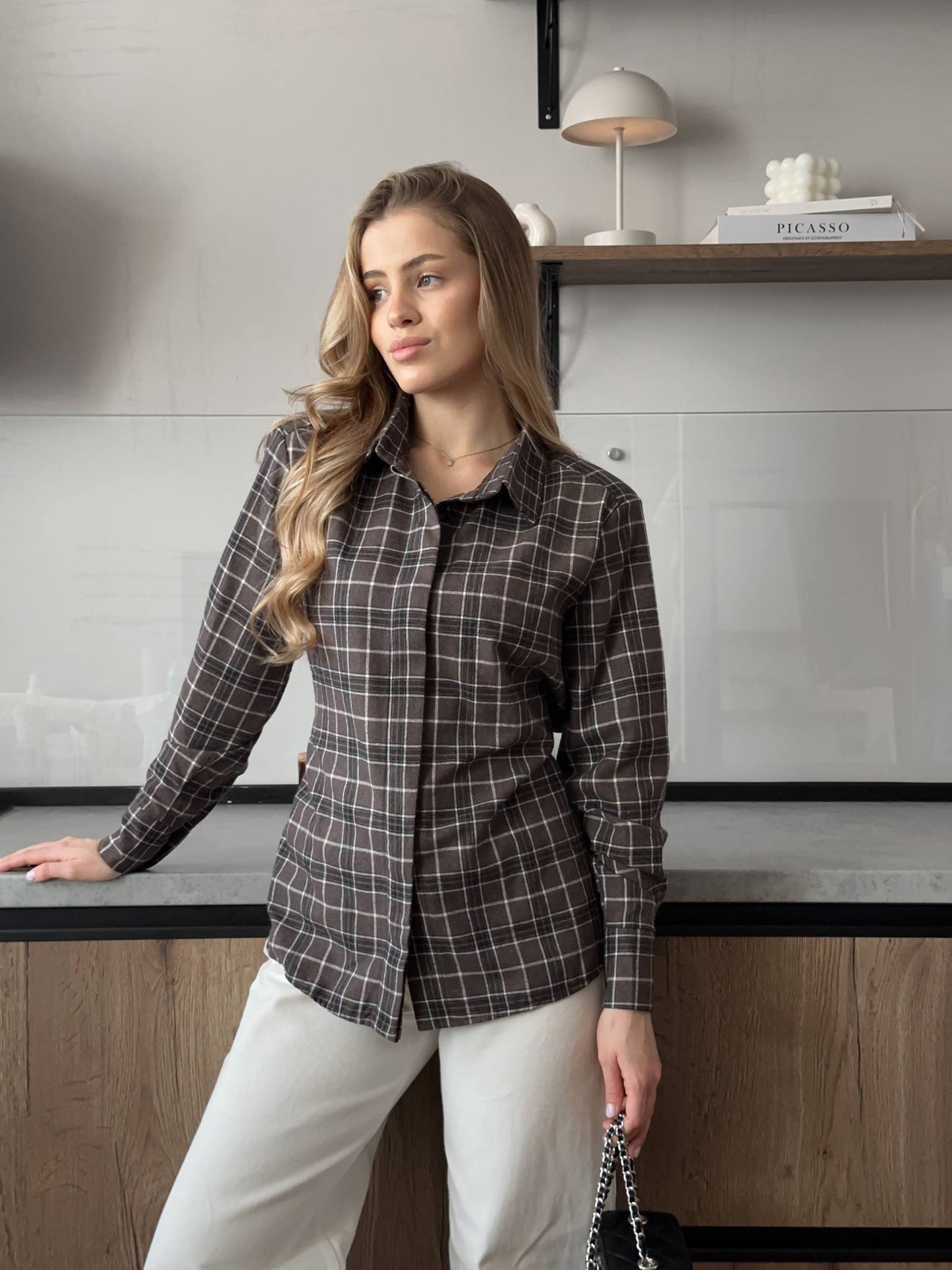 Shirt with shoulder pads
