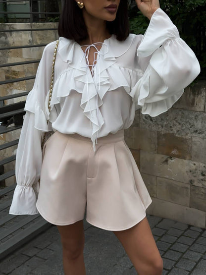 Ruffled blouse in milky white