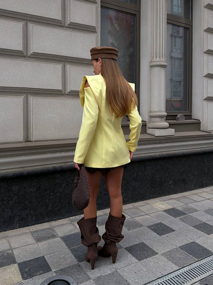 Suit: blazer with statement shoulders and skort
