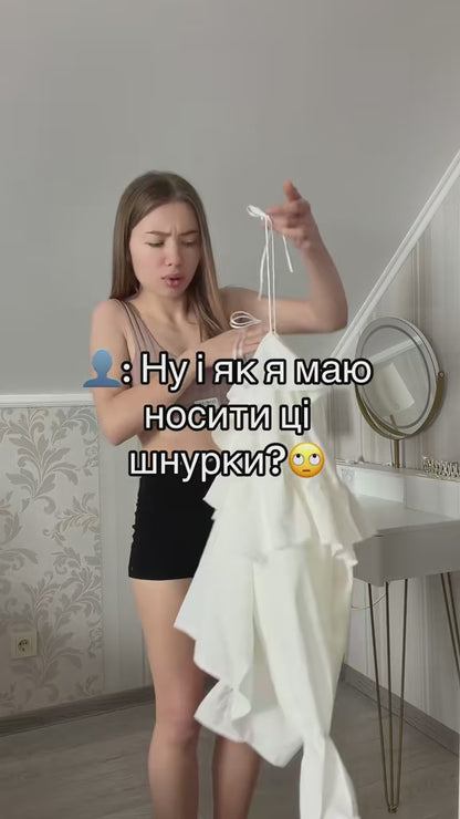 Ruffled blouse in milky white